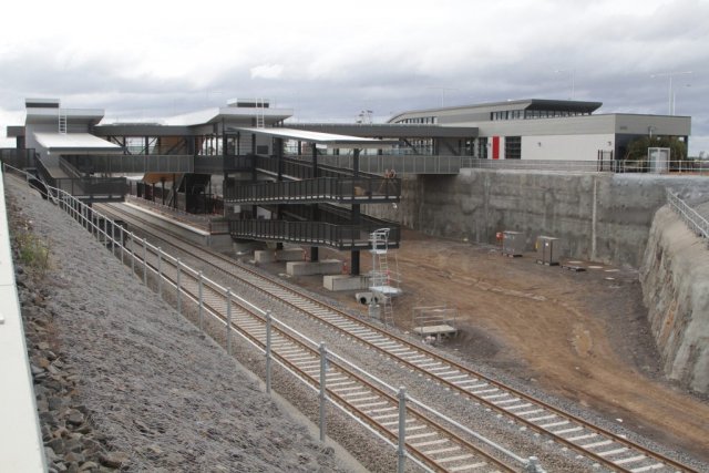 Multi-level ramps link the footbridge to platform level