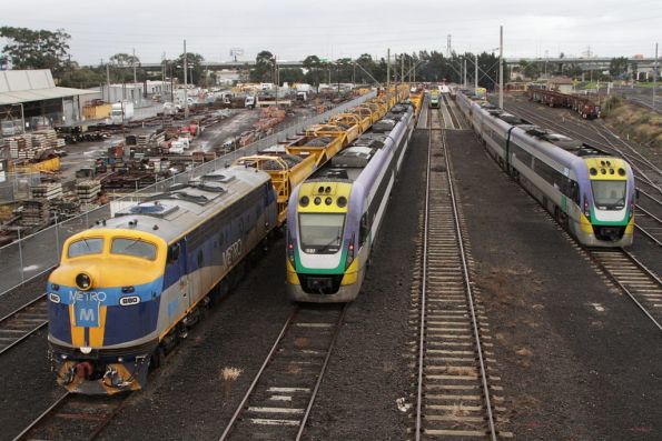 B80 stabled on a loaded ballast train in the Wagon Storage Yard at North Melbourne. V/Line railcars VL37 and VL38 alongside