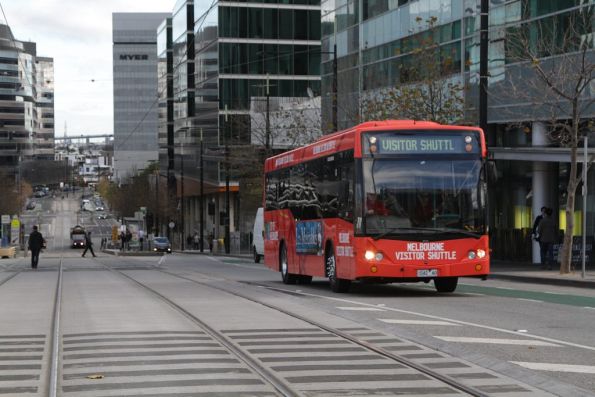 Melbourne Visitor Shuttle bus #42 1042AO heads east on Collins Street at Batman's Hill