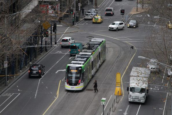 E.6009 on a test run, waiting to turn from William Street into Flinders Lane