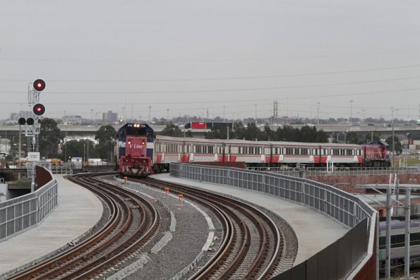 P14 climbs towards the North Melbourne flyover with a push-pull service bound for Southern Cross