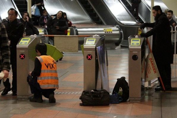 Pair of defective myki gates under repair at Flagstaff station