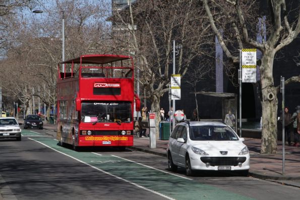 Melbourne City Sightseeing bus 9353AO pauses outside the National Gallery of Victoria on St Kilda Road