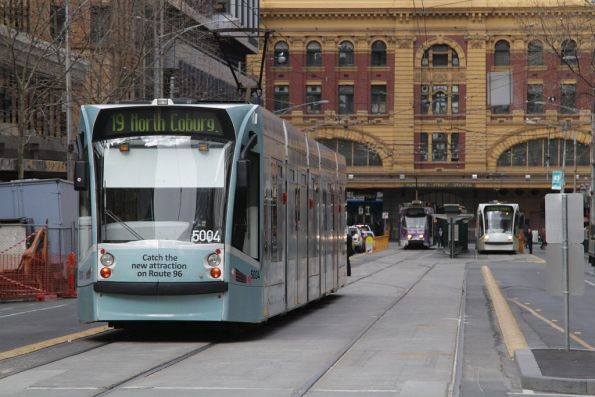 D2.5004 advertising new E class trams on route 96, but headed south  on route 19 along Elizabeth Street towards Flinders Street