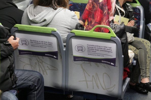 'Moving Victoria' propaganda stickers on the back of train seats, spruiking the Melbourne Rail Link project 