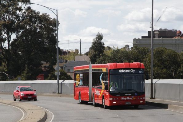 SkyBus articulated bus #95 rego BS00OH heads across the Dynon Road bridge