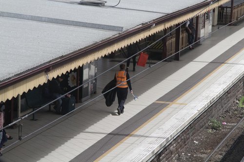 Extra cleaners on patrol at Flinders Street Station following the removal of every rubbish bin