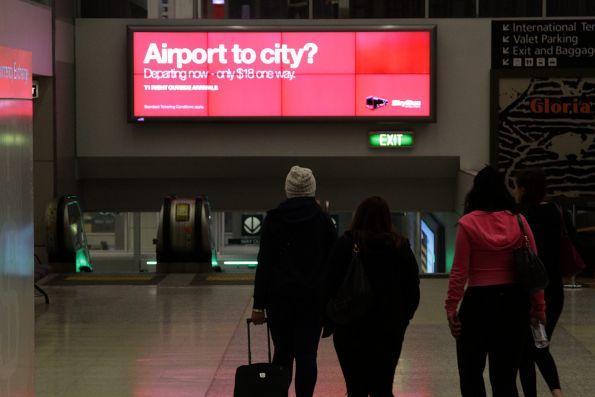 SkyBus advertisement inside Qantas Terminal 1 at Melbourne Airport