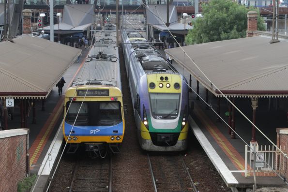 VLocity VL07 and classmate pass through the suburban platforms at North Melbourne with a down Seymour service