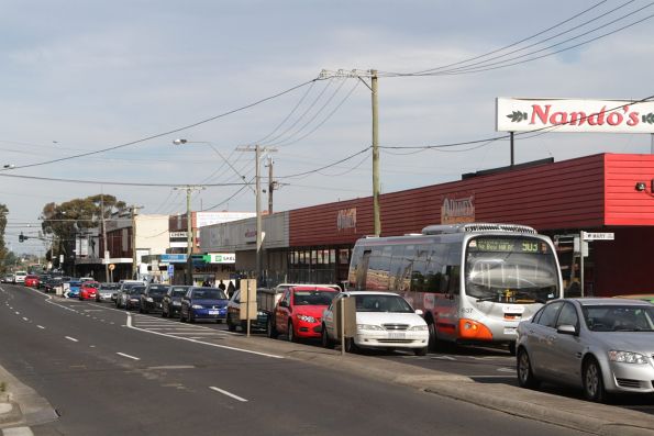 Transdev bus #637 rego 7260AO heads west on a route 903 service along Bell Street in Coburg