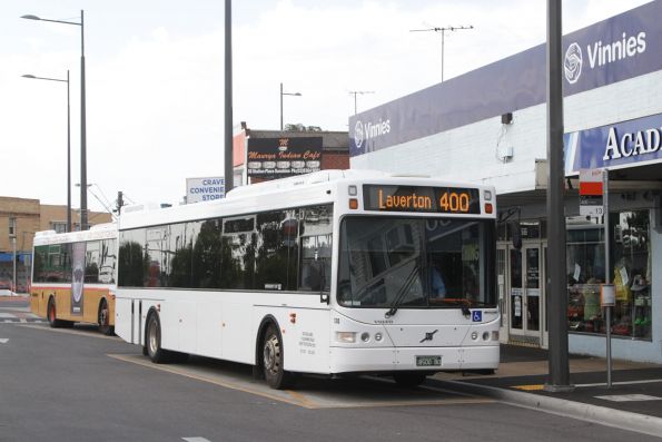 Plain white liveried Sita bus #130 rego BS00BO waits for route 400 passengers at Sunshine station