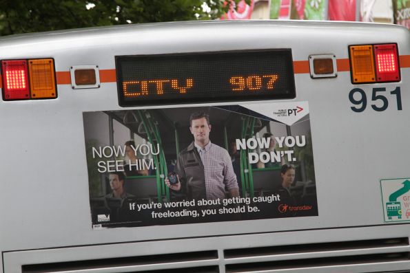 Transdev / PTV branded fare evasion advertisement on the rear of a bus