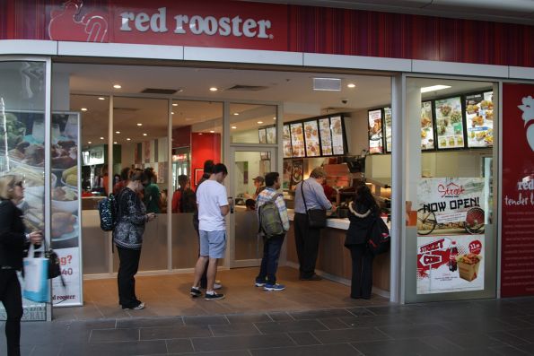 Red Rooster store at Southern Cross now has a glass wall between the paid and unpaid sections