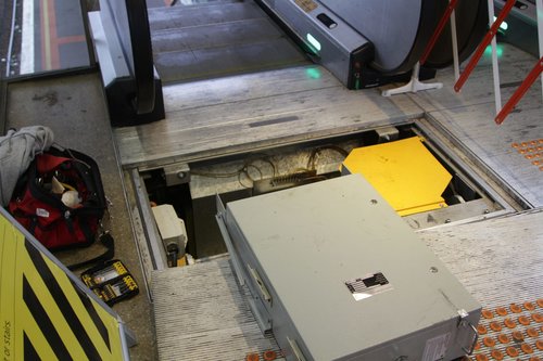 Technicians having to fix the dodgy escalators at North Melbourne yet again