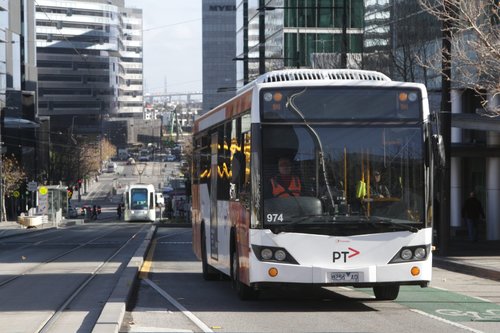 Transdev bus #974 rego 8256AO on a route 237 along Collins Street near Southern Cross