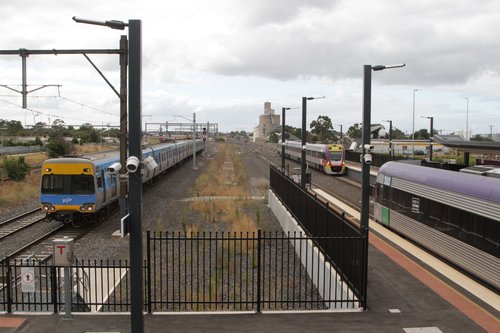 Trio of trains at Sunshine: pair of V/Line services outnumber the single Alstom Comeng