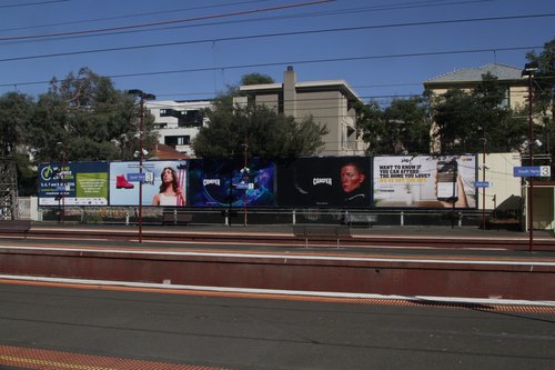 Array of advertising billboards at South Yarra station