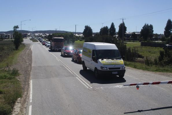 Queued cars on the north side of the Cardinia Road level crossing in Pakenham