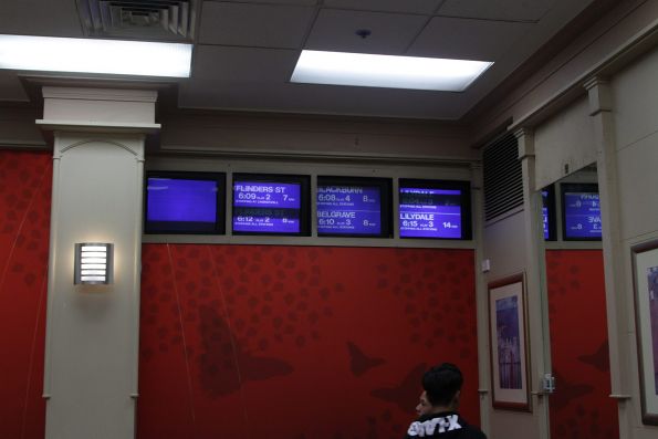 Next train displays inside the McDonald's dining room at Box Hill