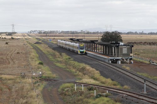 VLocity VL32 and classmate pass the future Caroline Springs station on an up Ballarat service