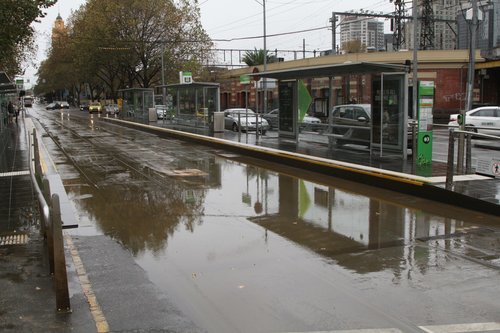 Floodwaters cover the tram tracks at Flinders and Market Streets