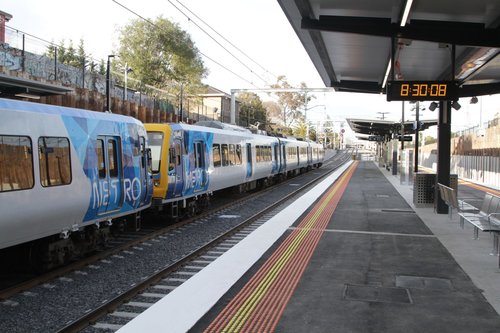 X'Trapolis 183M on a down Frankston service stops for passengers at the newly rebuilt low level station at McKinnon