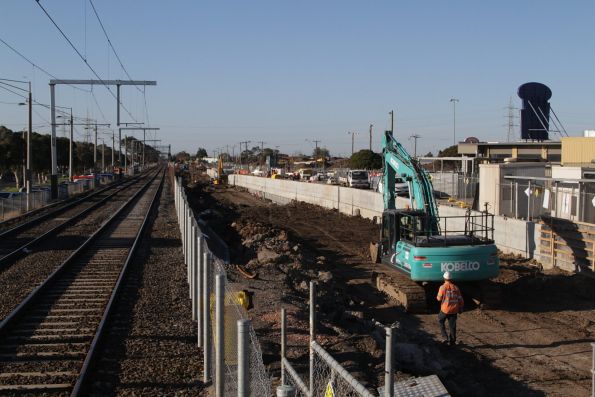 Removing dirt from the rail cutting at the up end of the new St Albans station