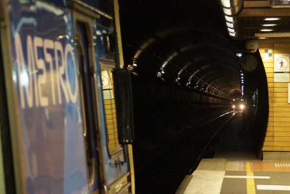 Comeng train about to depart Flagstaff station, as another Northern Loop train approaches in the tunnel behind