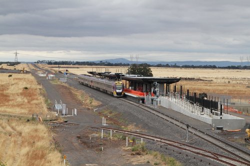 VLocity VL48 leads a classmate past the new Caroline Springs station