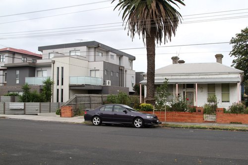 Houses along the railway line at Carnegie, already overlooked by three story high apartment buildings