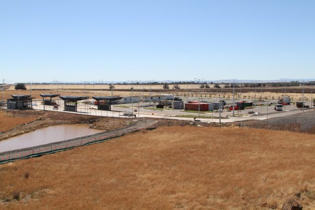 Site huts and construction material still fills the station car park