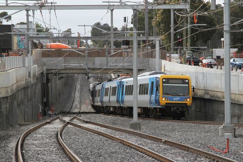 X'Trapolis 105M passes under Blackburn Road, arriving at Blackburn station on the up