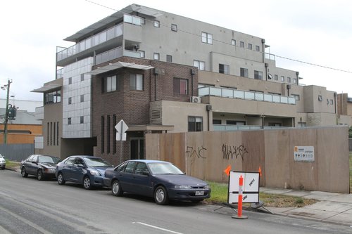 Five story high apartment block overlooks Carnegie station