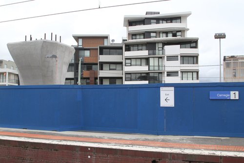 Six story apartment block overlooks Carnegie station platform 1