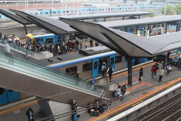 Passengers change between direct and City Loop trains at North Melbourne