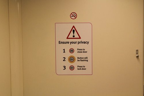 'Ensure your privacy' signage inside the disabled toilet onboard a VLocity train