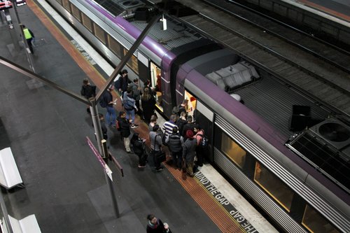 V/Line passengers board a VLocity train at Southern Cross platform 2