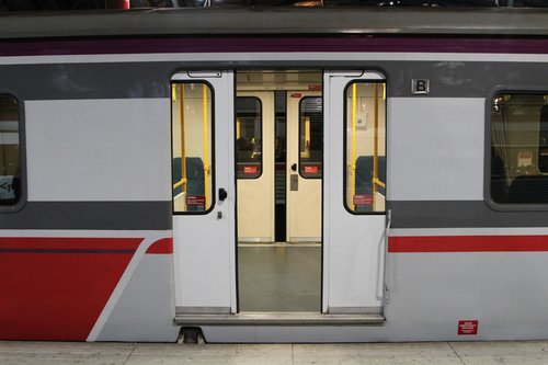 Empty carriage set at Southern Cross, doors on both sides of the train open