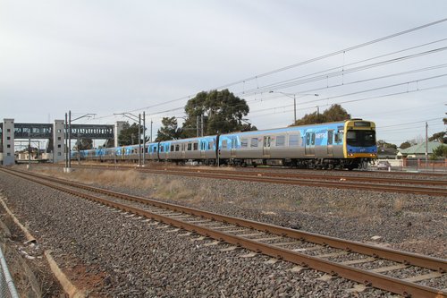 Comeng 327M leads a down Werribee service out of Laverton