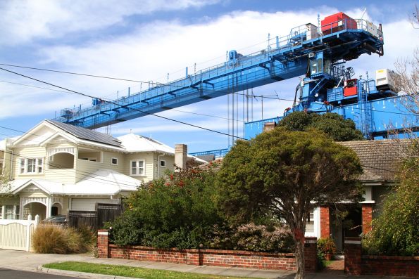 Straddle carriers at work placing viaduct spans between Murrumbeena and Carnegie stations