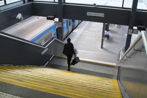 Steps between platform and concourse at Watergardens station