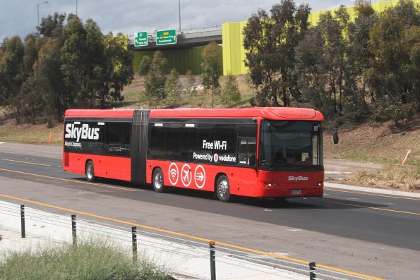 SkyBus articulated bus #87 9028AO southbound on the Tullamarine Freeway at the Western Ring Road