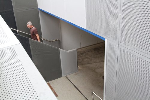 Steps and ramp down to the pedestrian subway at Southland station