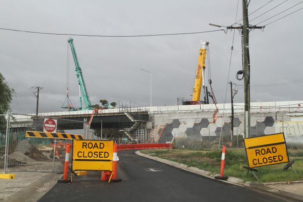 Packing up the cranes used to install the eastbound carriageway of the Melton Highway bridge at Sydenham