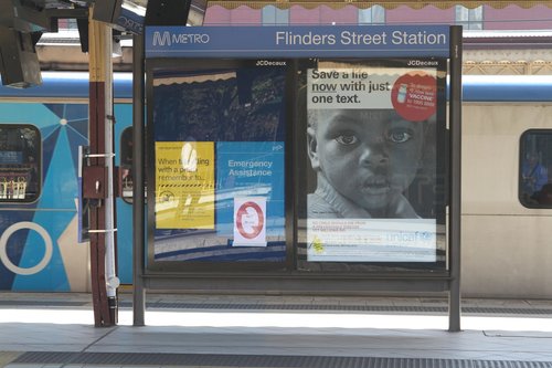 JCDecaux advertising panel marked for removal at Flinders Street Station platform 6 and 7