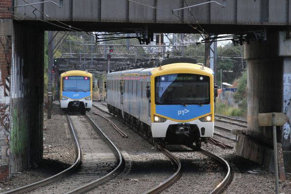 Siemens trains on up and down Frankston services cross paths outside Malvern station