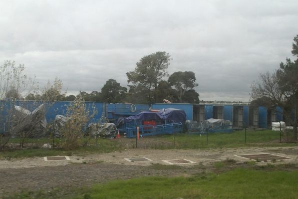 Components of the 'Skyrail' straddle carrier and gantry crane stored at Sandown Park racecourse