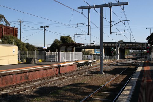 New overhead stanchions in use at Oakleigh station