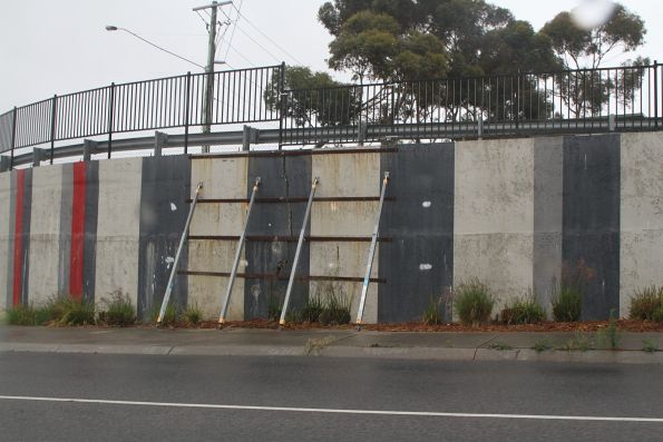 Failing retaining wall propped up in the Taylors Road underpass at Keilor Plains