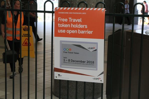 'Free Travel token holders use open barrier' sign at Flinders Street Station